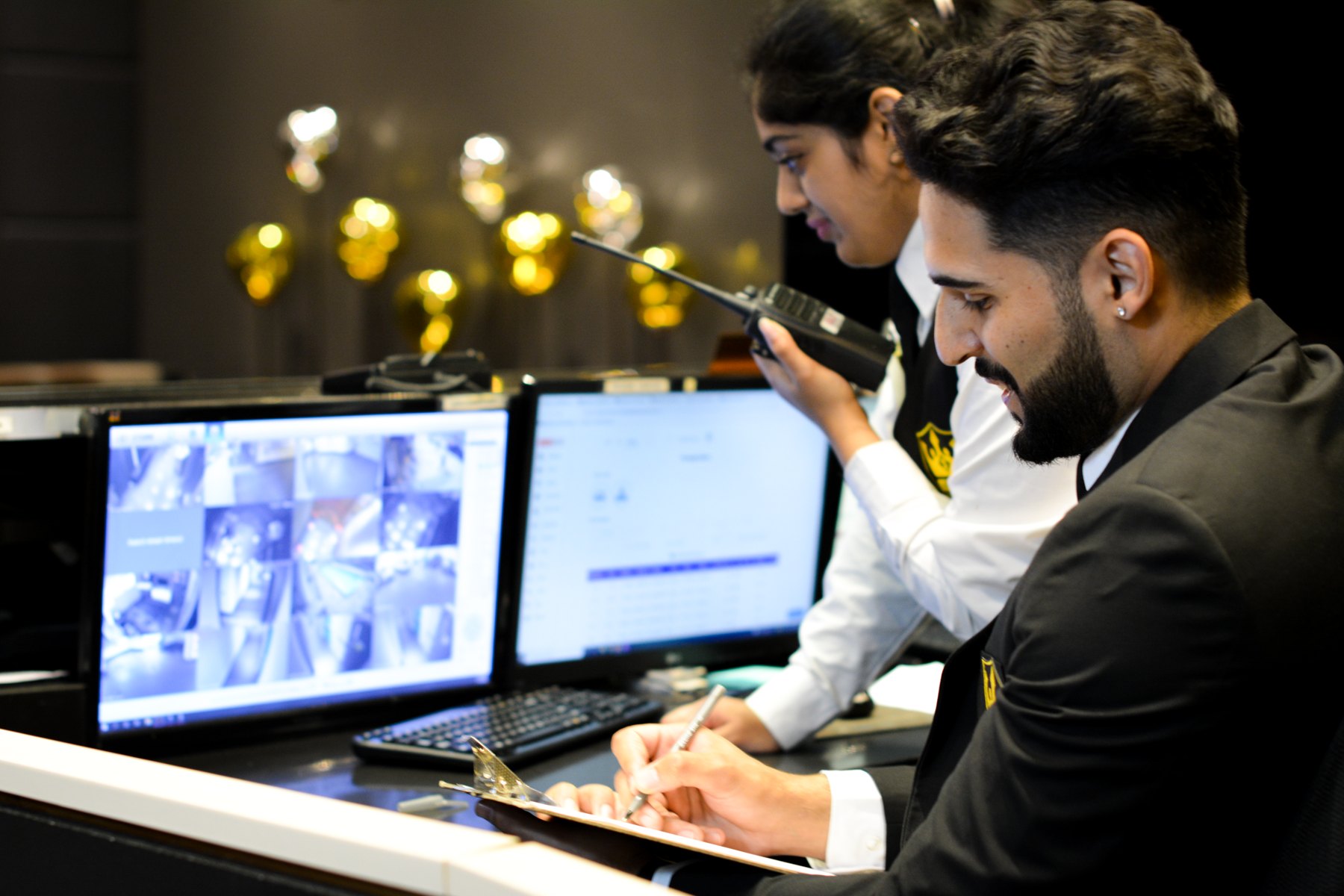 Royal concierge security officers at a condominium front desk